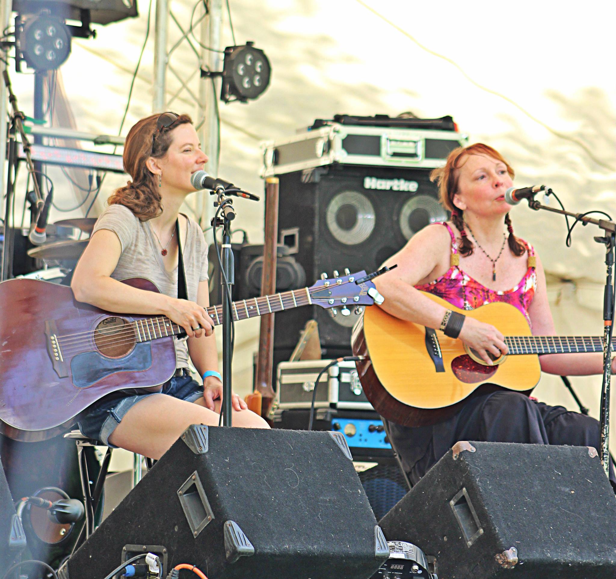 Kasey Rausch and Melinda Mullins performing on stage at Peach Tree Down South Music Festival in Crane, Missouri